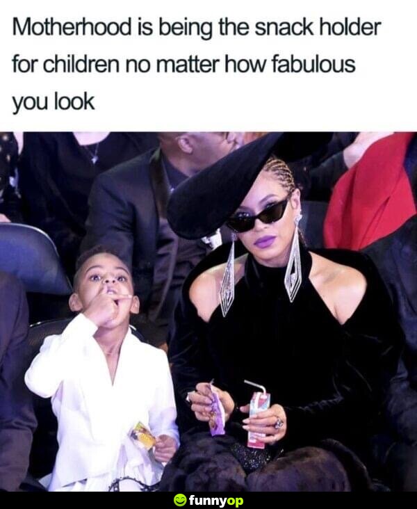 Motherhood is being the snack holder for children no matter how fabulous you look.