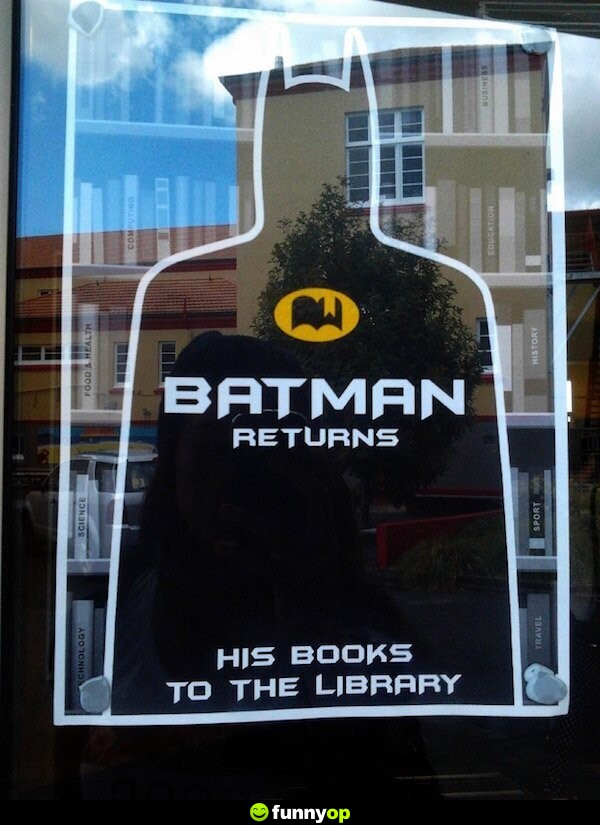SIGN: Batman Returns .. his books to the library.