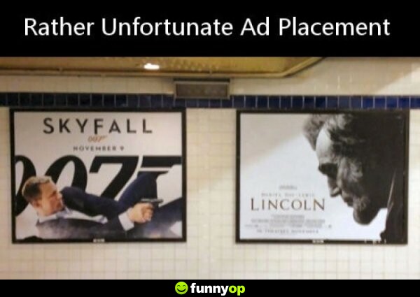 SIGNS: Skyfall movie poster next to Lincoln movie poster Rather unfortunate ad placement.